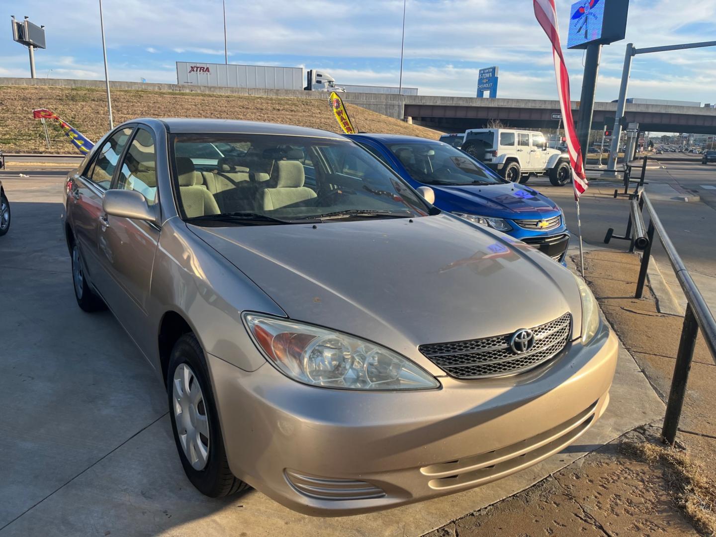 2003 GOLD TOYOTA CAMRY LE (4T1BE32K23U) with an 2.4L L4 DOHC 16V engine, located at 8101 E. Skelly Dr., Tulsa, OK, 74129, (918) 592-3593, 36.121891, -95.888802 - Photo#1